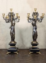 Pair of French bronze candelabras with female figures on black marble base, signed Salmson
