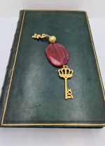 Charm with red Agate and gilded elements