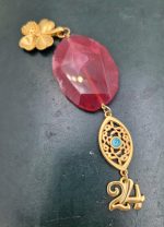 Charm with red Agate and gilded elements
