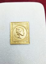 Gilded copy of a stamp with Hermes head on a marble base. - Image 2