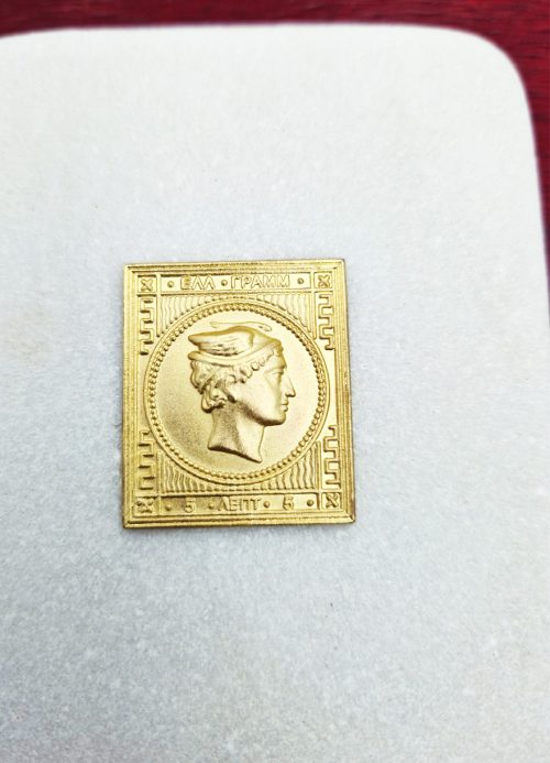 Gilded copy of a stamp with Hermes head on a marble base. - Image 2